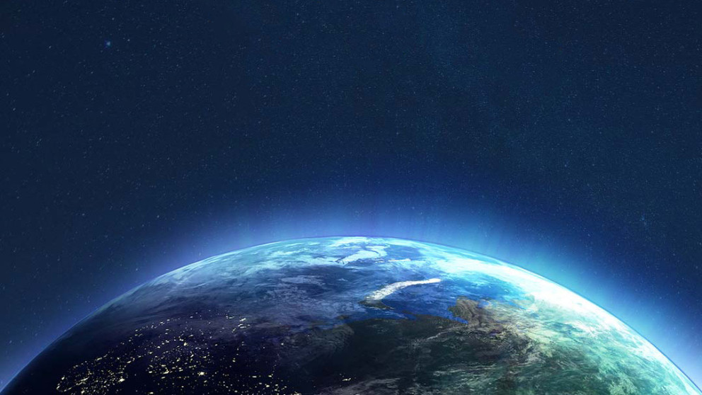 Illustration of the top half of the earth viewed from space. The planet has a blue glow effect.